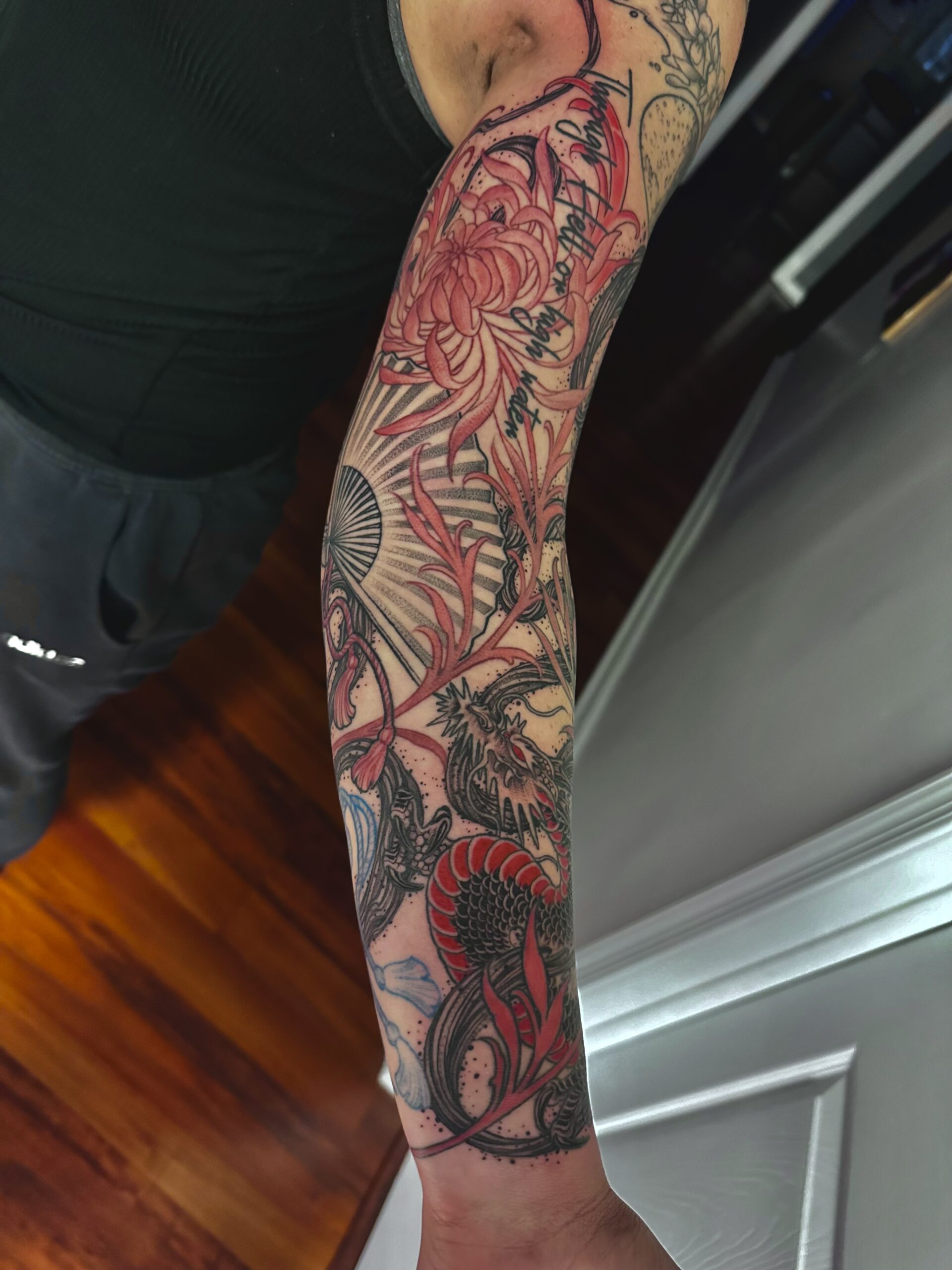 Japanese dragon sleeve tattoo by Chipi Camposeco at Inkcredible Tattoo in Virginia Beach