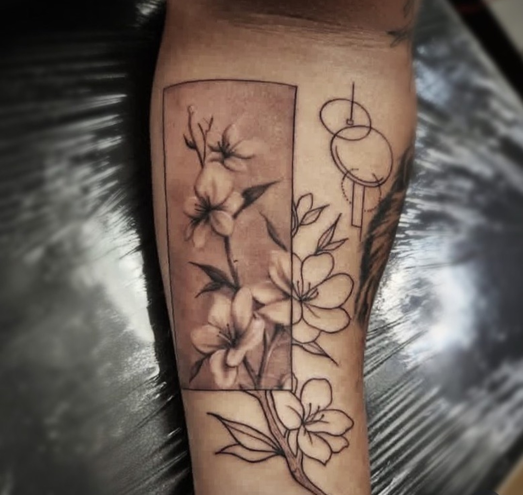 Fine-line flowers tattoo by Brian Allen at Inkcredible Tattoo Studio in Virginia Beach