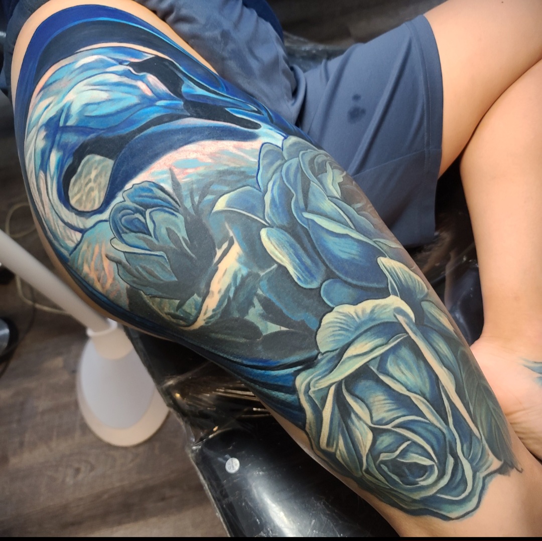 Blue floral sleeve tattoo by Mattlock Lopes at Inkcredible Tattoo Studio in Virginia Beach
