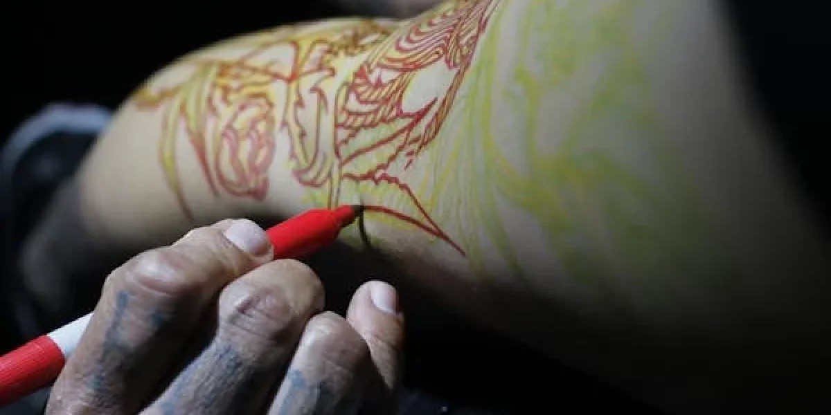 A drawn-on tattoo stencil showcasing custom design work, symbolizing the artistic craftsmanship of personalized tattoos – featured in ‘Custom Tattoos: The Rising Alternative to High-End Jewelry Sales’